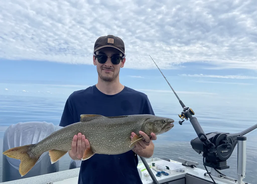 Another healthy Lake Ontario lake trout on calm morning water